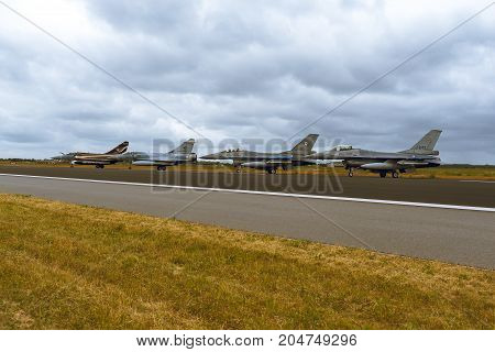 Schleswig - Jagel Germany - June 19 2014: Two Netherlands - Air Force F-16 Fighting Falcon and two French Air Force Dassault Mirage 2000 is taxiing during Tiger Meet 2014.