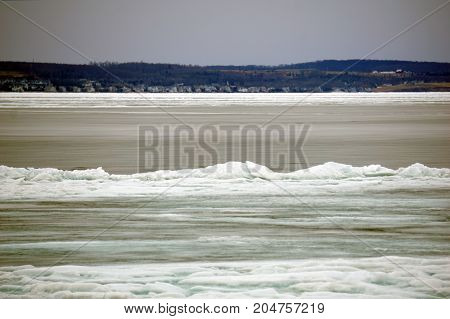 A view of ice-covered Little Traverse Bay, from the beach in Wequetonsing, Michigan, during March.