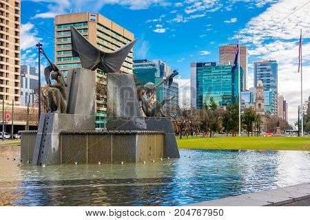 Adelaide Australia - June 28 2017: Victoria Square fountain viewed from South to North with office buildings at morning time