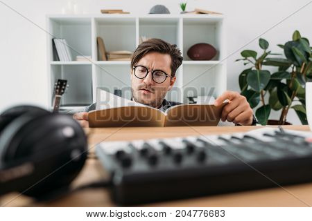 Young Musician Reading Magazine