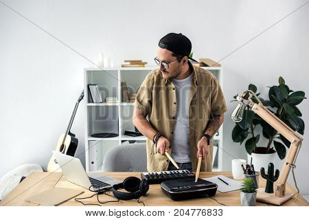 Sound Producer Playing On Drum Machine
