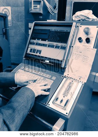 Display of programmable machine with big red button. Milling and lathe industry. CNC technology. Metal engineering. shallow DOF