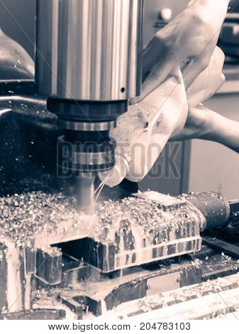 Milling metalworking process. Precision industrial CNC machining of metal detail by cutting mill at factory