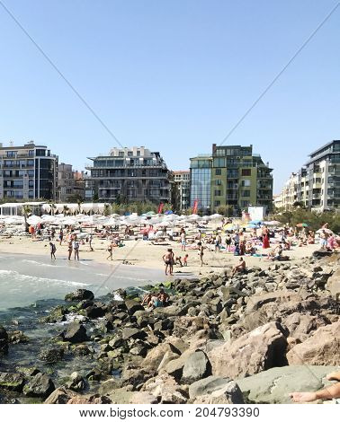 Pomorie Bulgaria - September 18 2017: People Enjoying Their Time At Pomorie Beach Bulgaria.