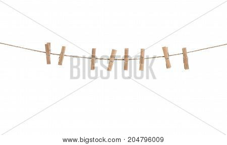Clothes line with pegs isolated over white background. Clothespins on rope