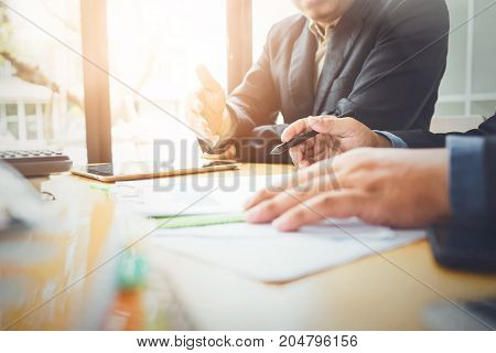 Co-workers are consultants on business documents, tax, transactions and business combinations after a bankrupt merger with a newly founded company.