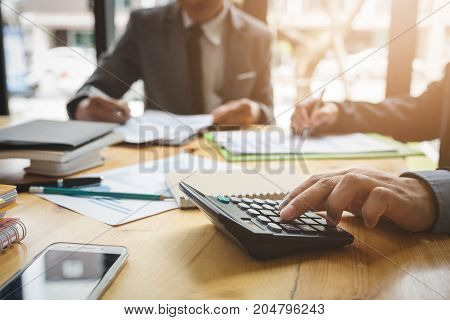 Co-workers are consultants on business documents, tax, transactions and business combinations after a bankrupt merger with a newly founded company.