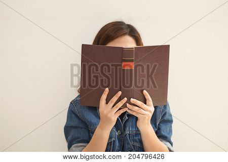 Asian Woman Reading A Book Vintage Style.