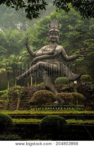 Buddha statue in Leshan in a beautiful green park, China. The Buddha statue in Leshan, China. Buddha statue in Leshan in a beautiful green park, China.