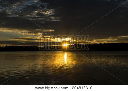 Sunset sky background. Dramatic gold sunset sky with evening sky clouds over the sea. Stunning sky clouds in the sunset. Sky landscape. Panoramic sky view.