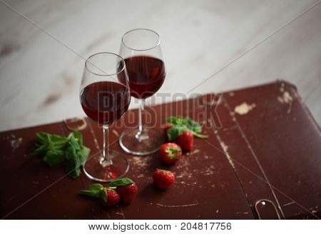 Wineglasses With Red Wine Decorated With Strawberry And Mint