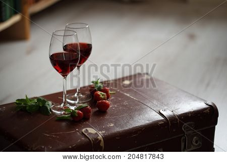 Wineglasses With Red Wine Decorated With Strawberry And Mint