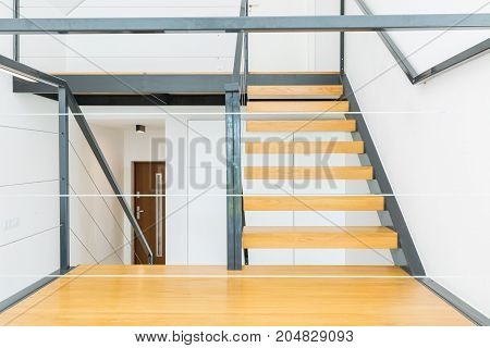 Wooden Stairs And Metal Railing