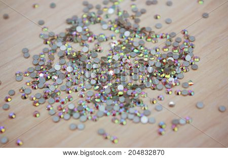 Rhinestone background. Mix of Shiny rhinestones crystals texture as backdrop isolated white studio photo.