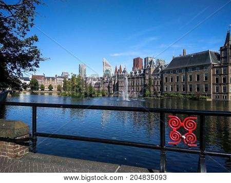 Binnenhof (Dutch Parliament) on modern city background The Hague (Den Haag) Netherlands