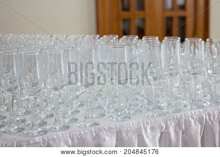 Wineglasses before fourchette clear and crystal. Selective focus