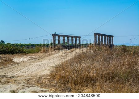 old small bridge and dirt road in comporta alentejo Portugal