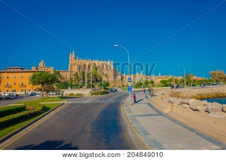 PALMA DE MALLORCA, SPAIN - AUGUST 18 2017: Unidentified people walking in the street near of harbor in Palma de Mallorca, Balearic islands, Spain.