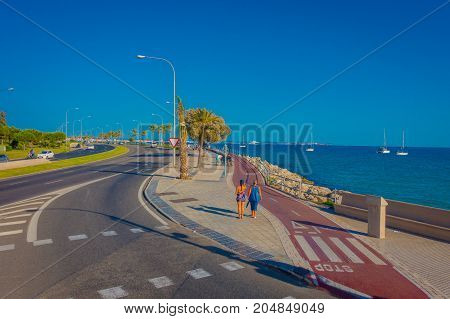 PALMA DE MALLORCA, SPAIN - AUGUST 18 2017: Unidentified people walking in the street near of harbor in Palma de Mallorca, Balearic islands, Spain.