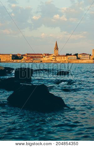 Summer holiday by the sea. Sunset on the seashore. City View Walk along the seafront