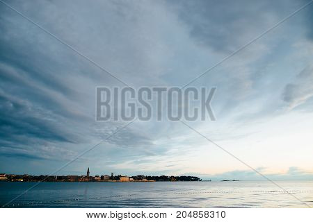 Summer holiday by the sea. Sunset on the seashore. City View Walk along the seafront