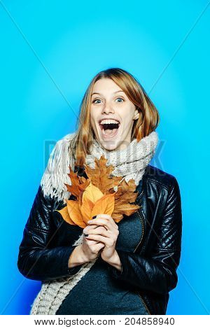 Woman With Autumn Leaves In Leather Jacket