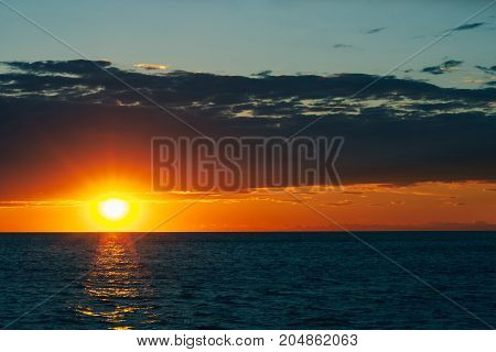 Sunset On The Seashore. City View Walk Along The Seafront