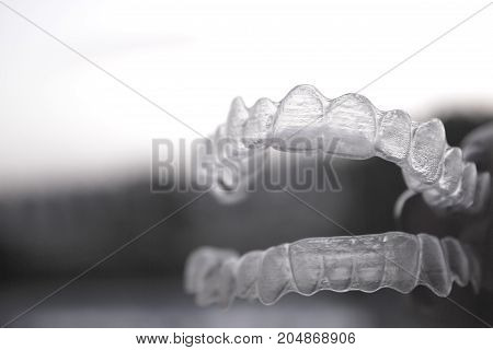 Invisible orthodontics for aligning teeth. No people