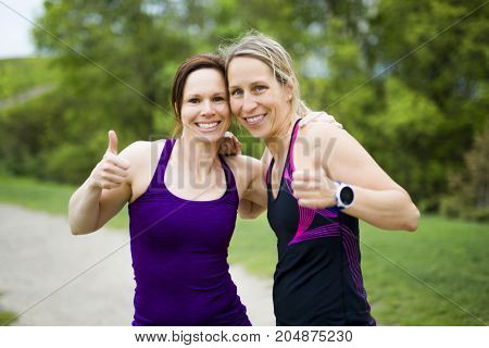 Two Beautiful Female runner outside having fun