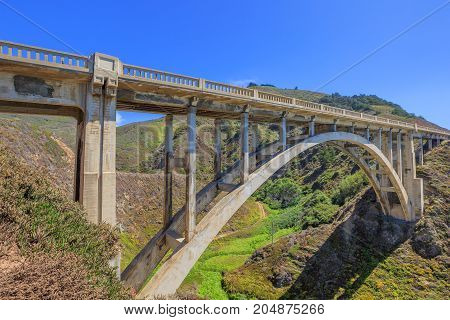 Scenic view of iconic Bixby Bridge on Pacific Coast Highway Number 1 in California, United States. Bixby Bridge is most photographed and popular bridge located in Big Sur. American travel concept