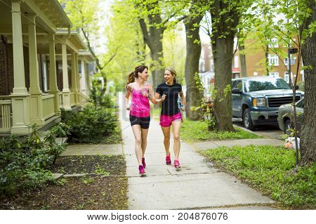 Two Beautiful Female runner outside having fun