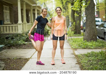 Two Beautiful Female runner outside having fun