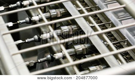 Food factory automated robotic production machine. Conveyor product line for cooking and packing rations and foods. Robotics and automatic lines used instead of human labor on factories and plants.