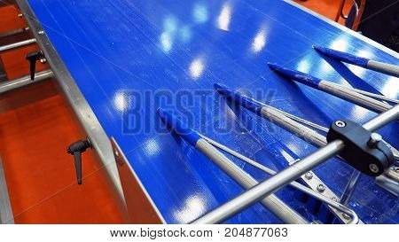 Food factory automated robotic machine. Conveyor product line for cooking and packing rations and food packs. Robotics and automatic lines used instead of human labor on factories and plants.