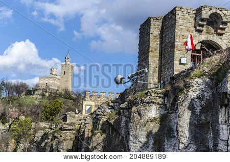 In the background is the cathedral of the Bulgarian city Veliko Tarnovo and to the right the entrance to the old fortress on the bank of Tsarevets here was the capital of the second Bulgarian Empire