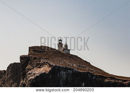 Side view of Anacapa Island off the coast of Port Hueneme, California, in Ventura County, with the Anacapa lighthouse high on top.