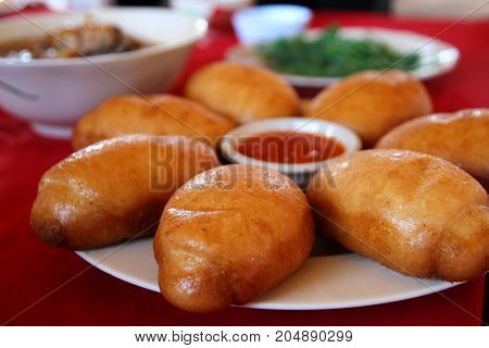 Chinese steamed bun or mantou in deep fried till it become golden color