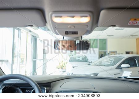 The beautiful couple chose a new car for themselves. The concept of buying a new car.