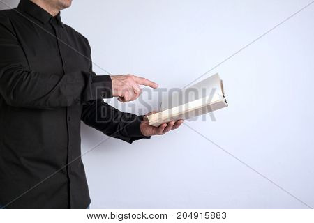 Free space for text, marketing education and business information. Man with a book on white background.