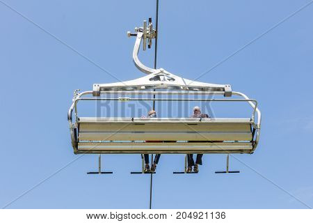 Ski Lift Chair In The Alps - Unrecognisable People In It