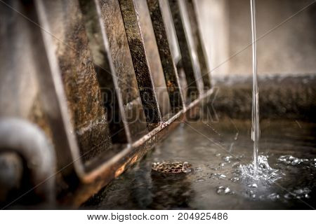 Details of an old rusty fountain. Shallow dof.
