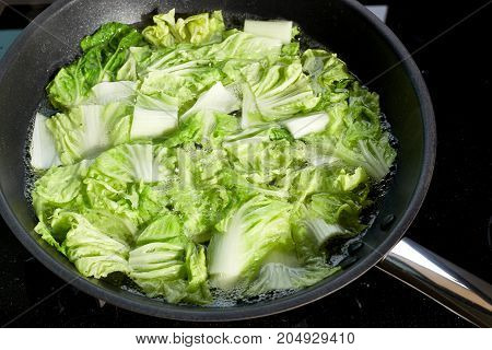Chinese cabbage chopped in a healthy boiled wok