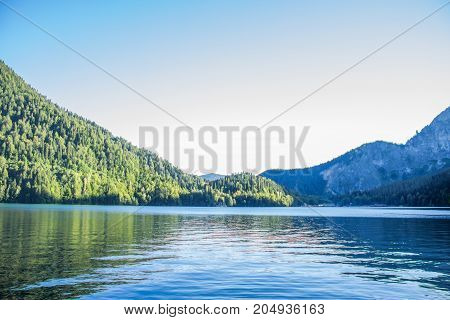 The beautiful lake ritsa in Abkhazia. Landscape of the mountains of the forest and the lake