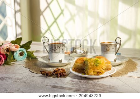 Two Cups Of Turkish Coffee And Plate With Baklava