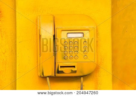 old street yellow phone. screen and buttons