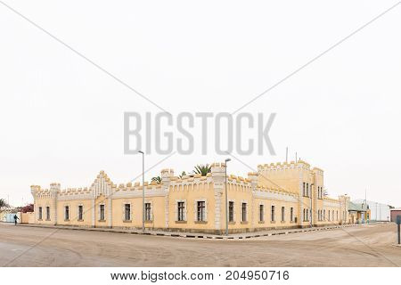 SWAKOPMUND NAMIBIA - JUNE 30 2017: A street scene with the Kaserne building in Swakopmund Namibia in typical German Colonial style. Built as barracks for the German army in 1905