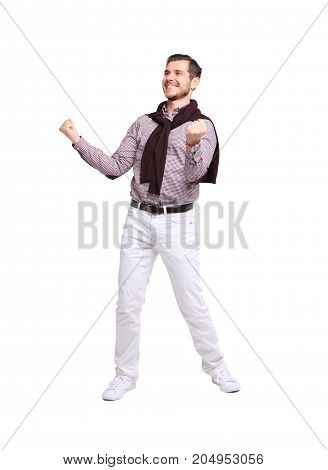 Excited handsome man with arms raised in success - Isolated on white