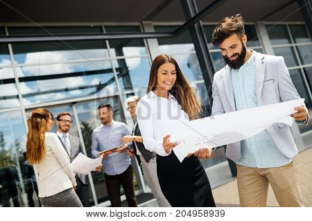 Young attractive designers talking on break about business plans
