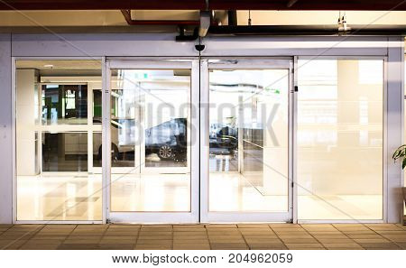 Blank sliding glass doors entranceat airport.Glass doors in an office