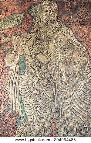 Lord Krishna depicted on a wall decoration resembles an ancient art